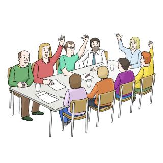 Abstimmung Es sitzen 9 Menschen an einem Tisch und stimmen ab.