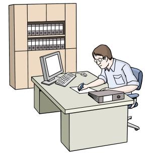 Büroarbeiter am Schreibtisch Ein Mitarbeiter sitzt am Schreibtisch und arbeitet.